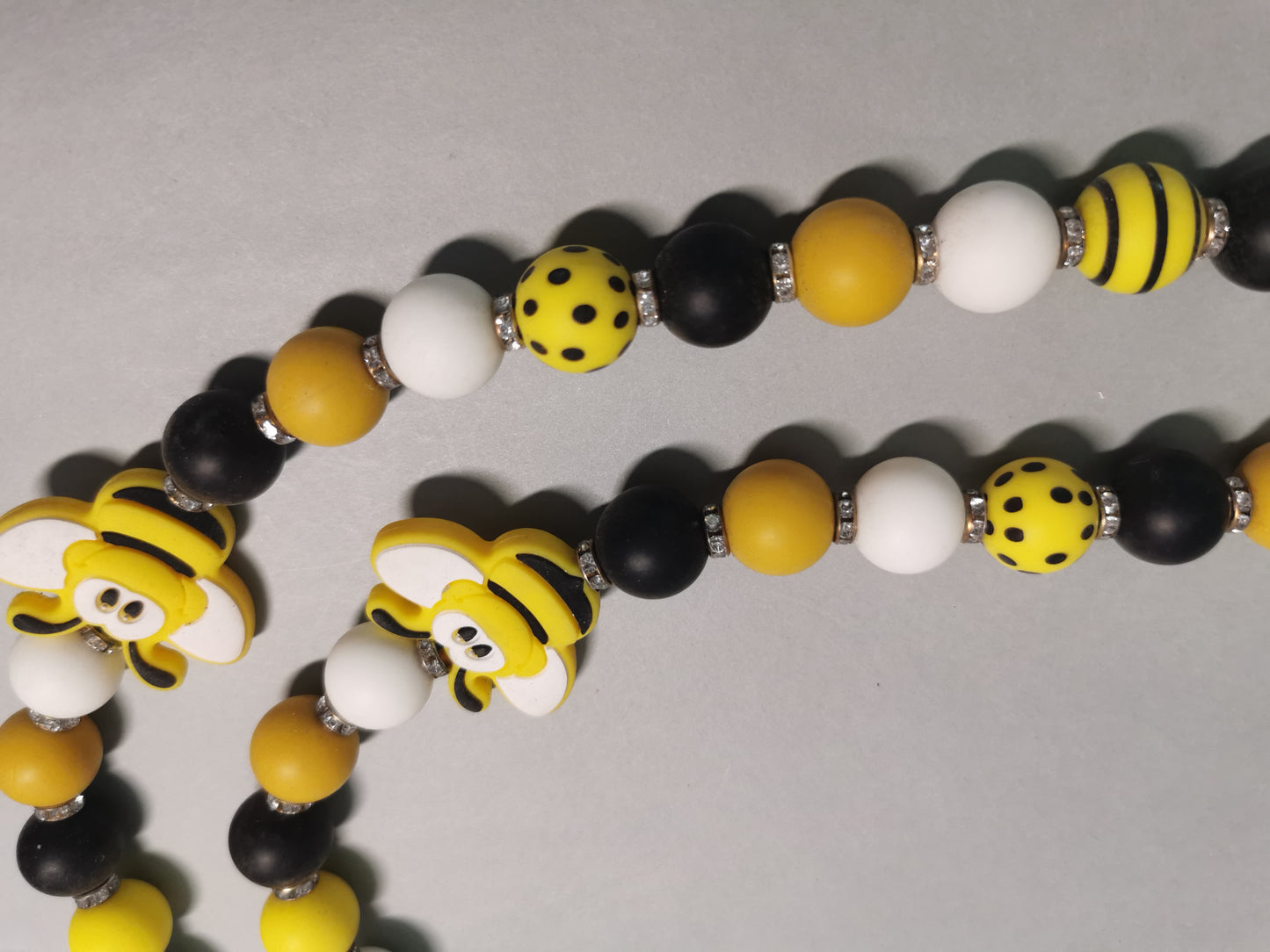 Handyperlenkette Biene