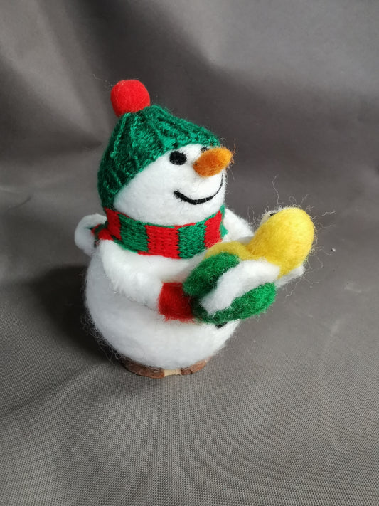 Schneemann mit Engelspuppe